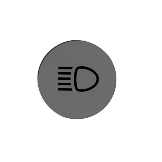 A circular gray badge or emblem featuring a black headlight symbol in the center, shown on a plain light gray background.